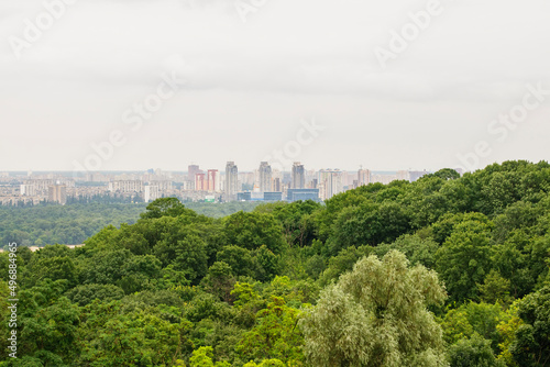 Kyiv, Ukraine. July 19. 2014. Cityscape of Kyiv, view of the left bank and the Dnieper River. Modern city in the distance, evening time