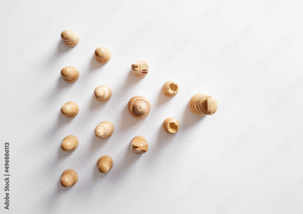 Top view of chess pieces following the king. Leadership of following the leader Top view of chess pieces following the king. Leadership of following the leader