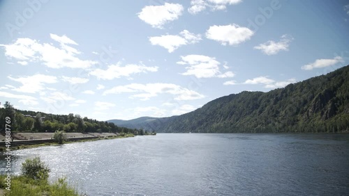Wide river and mountains in background. Divnogorsk city near Yenisei river. photo