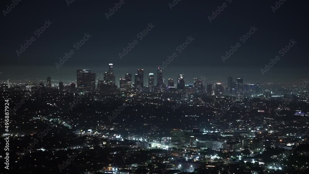 The iconic Los Angeles skyline cityscape at night from a distance