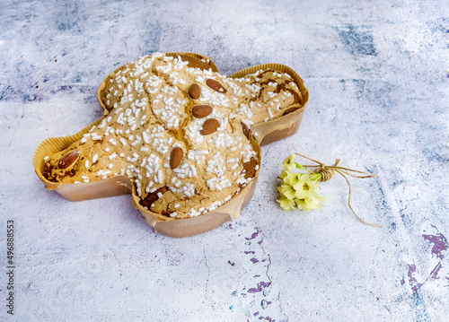 Traditional Italian Easter Dove Bread on white wooden background photo