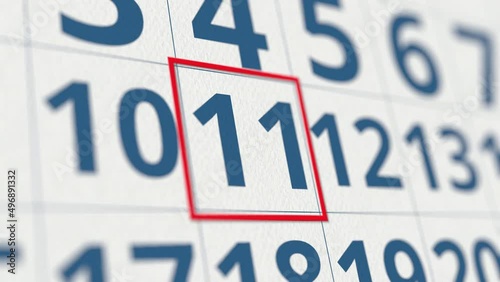 Calendar with marked 11 day of the month close-up photo