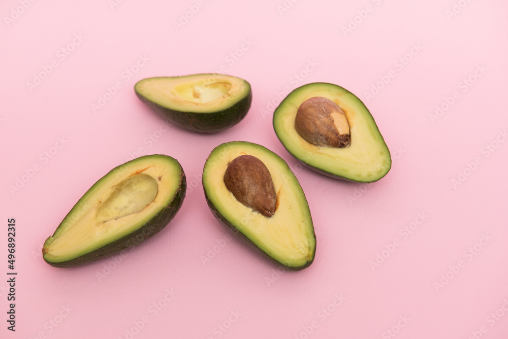 Avocado on a pink background Avocado on a pink background