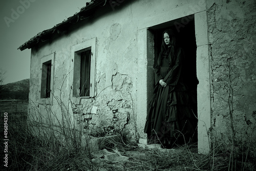 Haunted woman in black dress