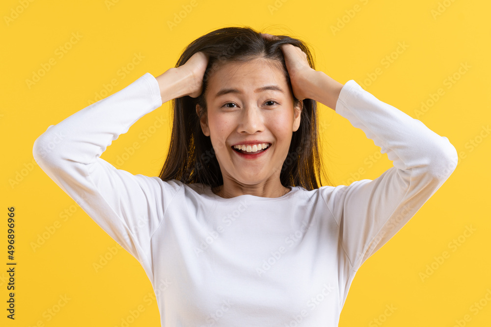 Beautiful young woman surprised facial expression after seeing shocking, amaze deal isolated on yellow background. Studio shot. Beautiful young woman surprised facial expression after seeing shocking, amaze deal isolated on yellow background. Studio shot.