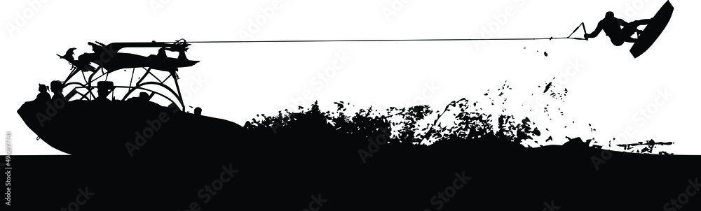 A wakeboard boat pulling a wakeboarder doing a trick.