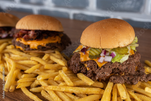 Smash burger trio on top of fries