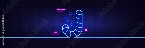 Neon light glow effect. Christmas candy line icon. Cane lollypop sign. 3d line neon glow icon. Brick wall banner. Candy outline. Vector