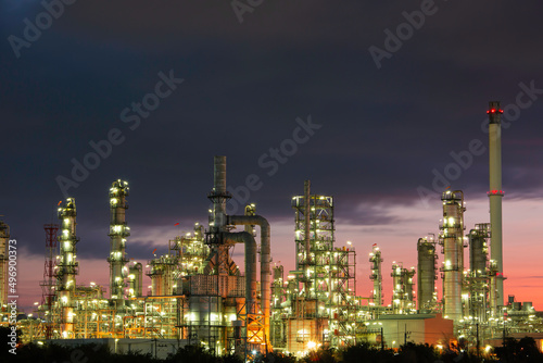 Oil​ refinery​ and​ plant and tower column of petrochemistry industry in pipeline oil​ and​ gas​ ​industry with​ sun red sky the morning © chitsanupong