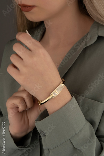 Evil eye bead gold bracelet, icon gold bracelet, on the woman's arm
