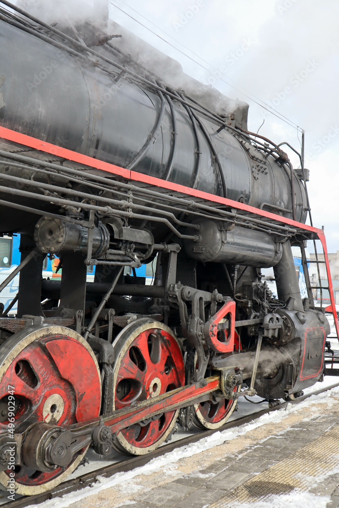 retro steam lococmotive in the winter on the station