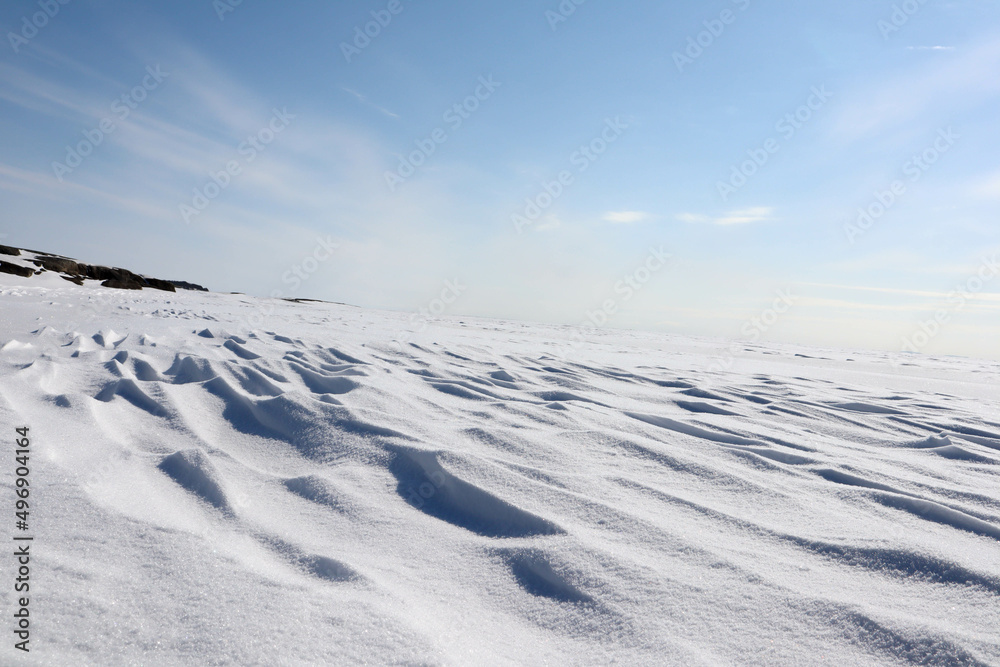 landscape with snow covered lake Ladoga under clear blue sky