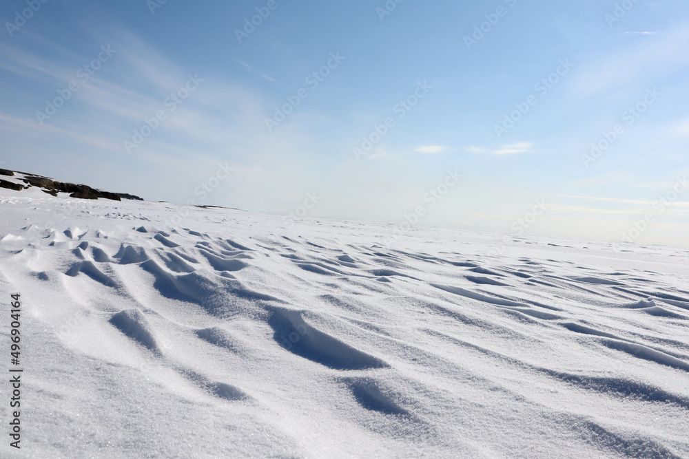 landscape with snow covered lake Ladoga under clear blue sky landscape with snow covered lake Ladoga under clear blue sky