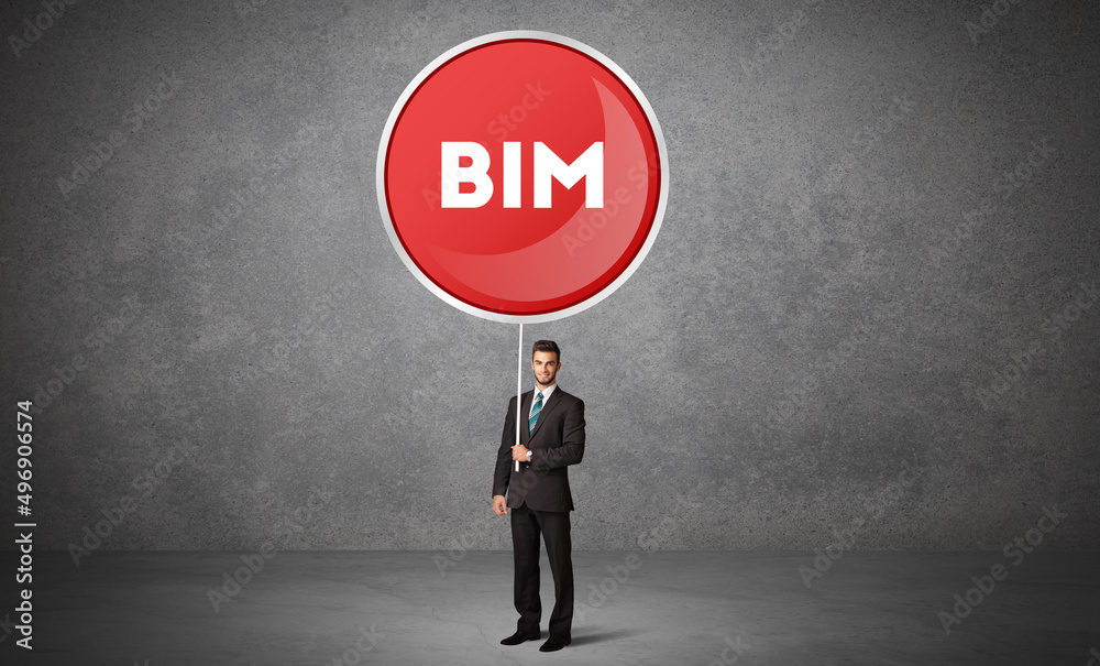 Fototapeta premium Young business person holdig traffic sign