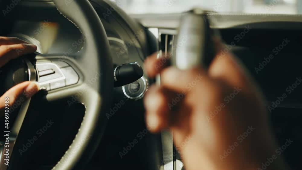 Close up of man holding contactless car key in hand. Starting car engine button. Finger press the button to start the car engine. Starting car engine.