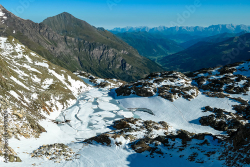 Panoramic view on the mountains of High Tauern Alps in Carinthia and Salzburg, Austria, Europe. Glacier lakes of the Goldbergkees in the Hohe Tauern National Park. Patagonia like landscape. Snow photo
