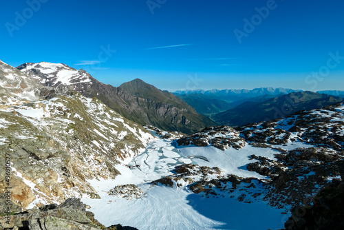 Panoramic view on the mountains of High Tauern Alps in Carinthia and Salzburg, Austria, Europe. Glacier lakes of the Goldbergkees in the Hohe Tauern National Park. Patagonia like landscape. Snow