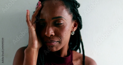 Worried black woman feeling anguish. anxious African female photo