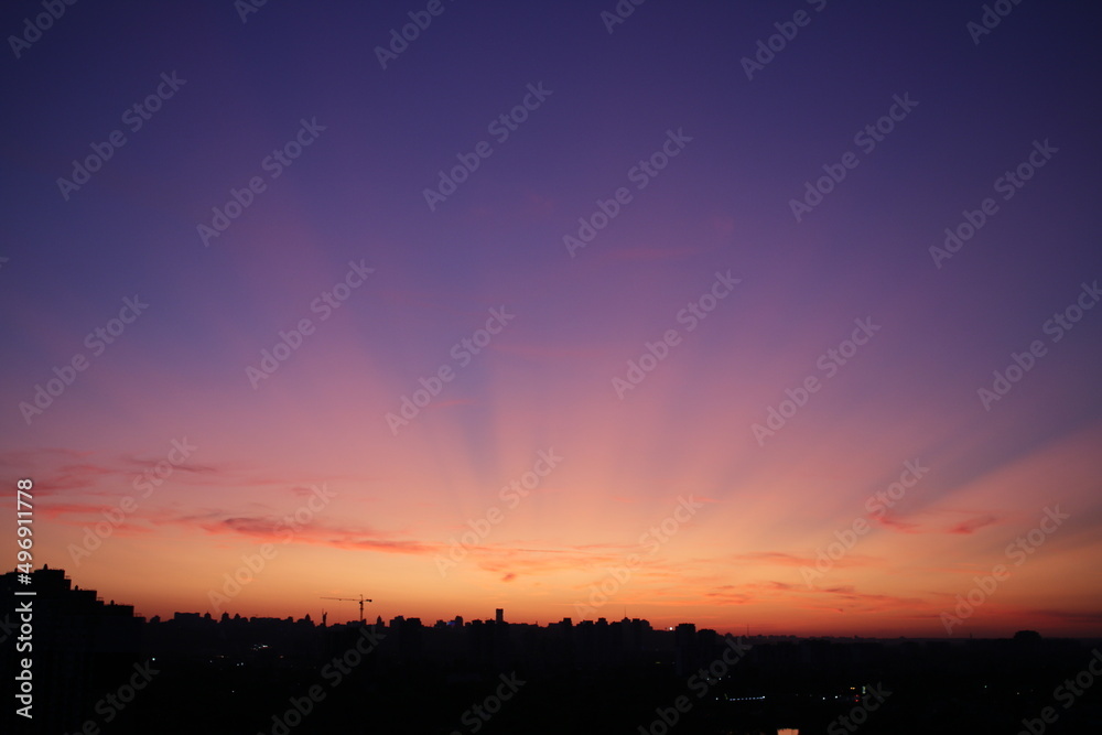 foto of beautiful sunset sky above city silhouette