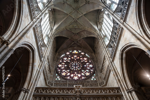 The interior of the central nave of St. Vitus Cathedral with Gothic ribbed mesh vaults and a Gothic rose. Prague, Czech Republic