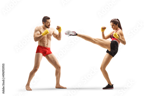 Male and female athlets exercising kick boxing photo