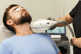 Man during beard photoepilation procedure