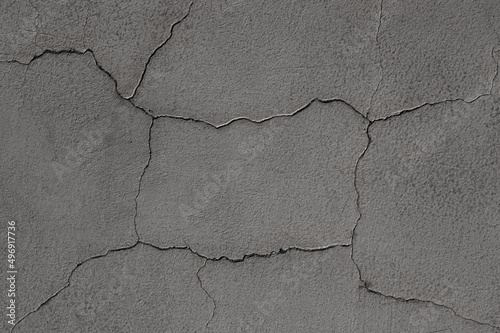 gray background. in the photo, an old gray concrete wall in close-up.
