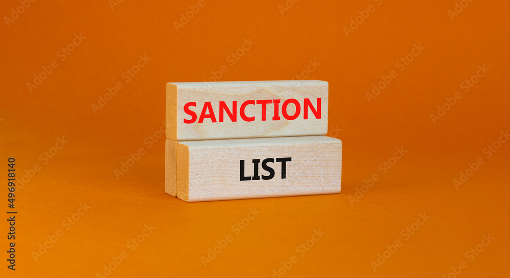 Sanction list symbol. Wooden blocks with concept words Sanction list on beautiful orange background. Business political sanction list concept. Copy space. Sanction list symbol. Wooden blocks with concept words Sanction list on beautiful orange background. Business political sanction list concept. Copy space.