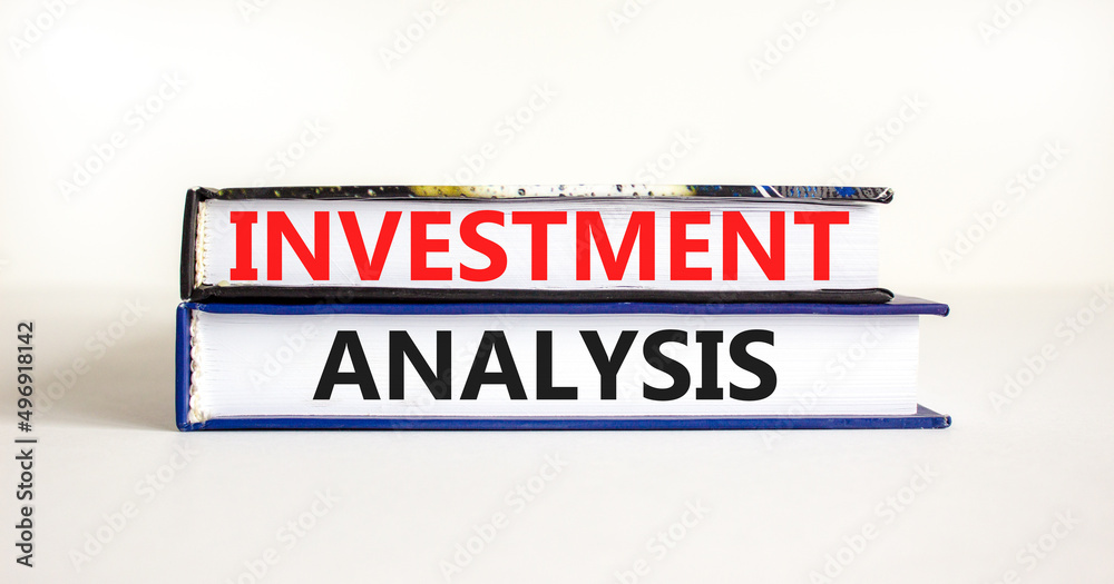 Investment analysis symbol. Books with concept words Investment analysis on beautiful white background. Business investment analysis concept. Copy space.
