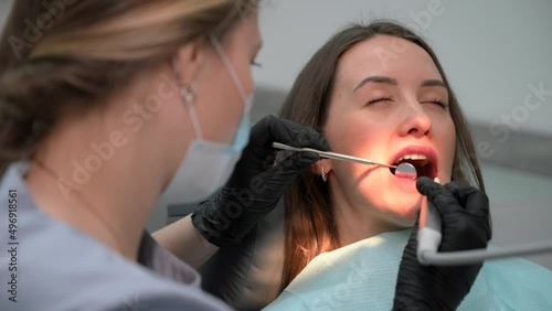 Female dentist at work. Dental treatment in a modern dental clinic. Close up