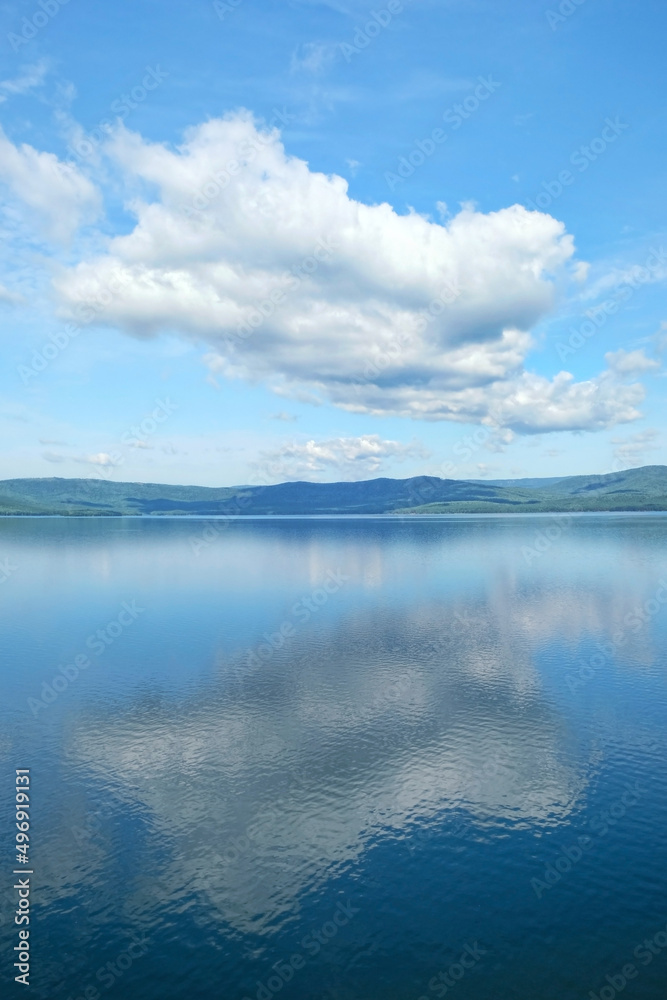 Beautiful blue lake and big clouds in sky. Summer landscape. atmospheric scenic view. travel, adventure and vacation concept. relax time. Russia, South Ural, lake Turgoyak