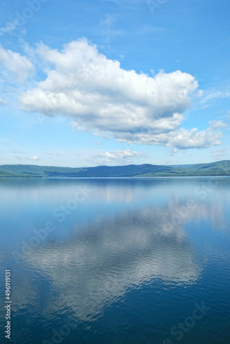 Beautiful blue lake and big clouds in sky. Summer landscape. atmospheric scenic view. travel, adventure and vacation concept. relax time. Russia, South Ural, lake Turgoyak