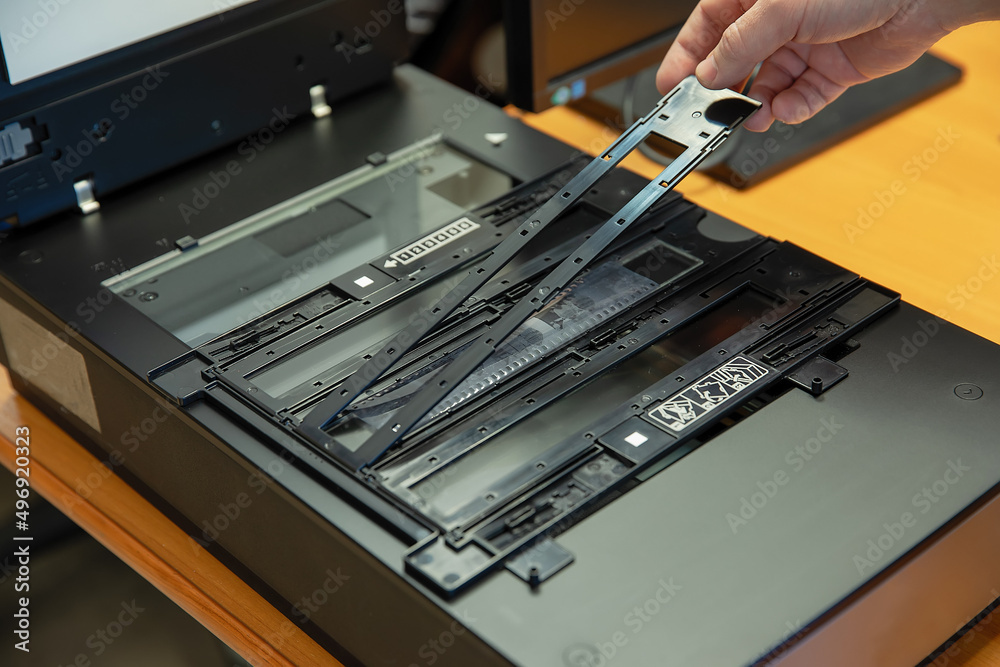 Digitization scanning of photographic film negatives on the scanner. Converting an image to digital form.