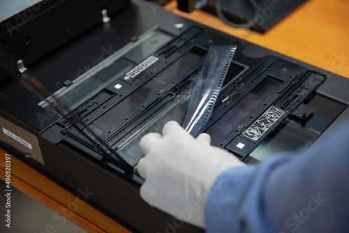 Digitization scanning of photographic film negatives on the scanner. Converting an image to digital form.