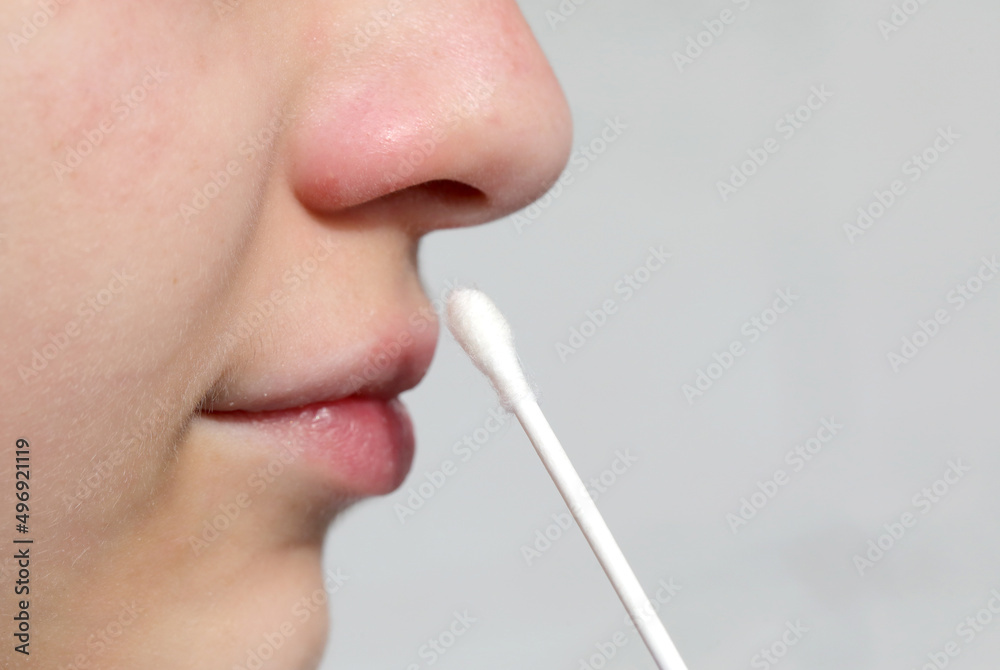 swab to carry out a test and rapid for the search for coronavirus in the nose of the young girl swab to carry out a test and rapid for the search for coronavirus in the nose of the young girl
