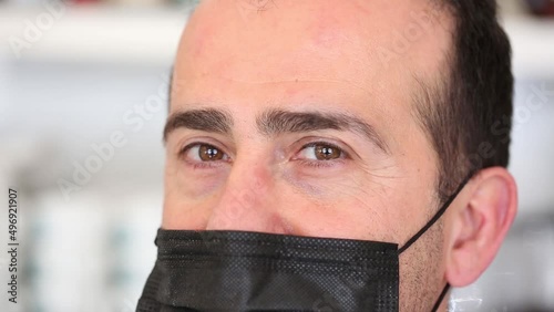 Close up portrait of charming mature man in medical face mask