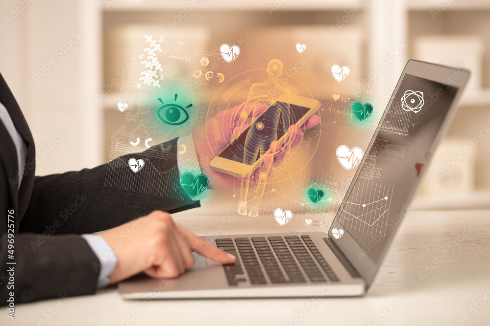 Doctor working on laptop with healthcare concept Doctor working on laptop with healthcare concept