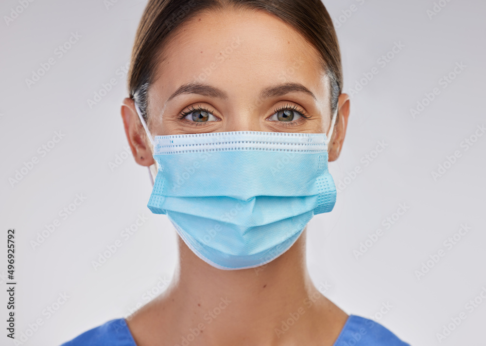 Im here to help. Shot of a young female nurse against a studio background.