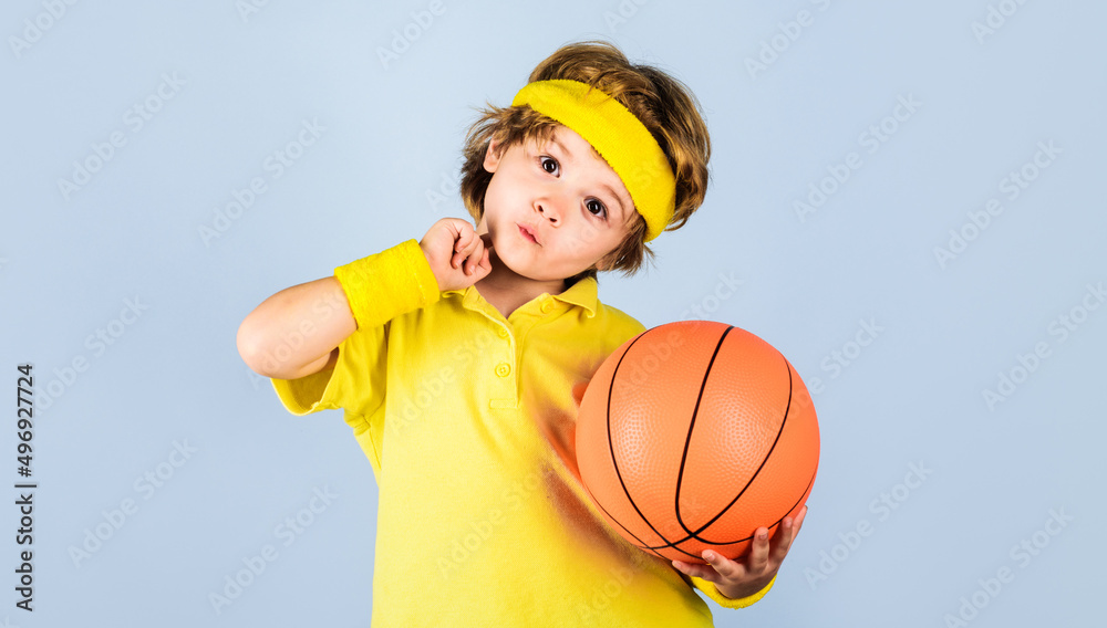 Little basketball player in sportswear with ball. Children and sport game. Active sports lifestyle. Little basketball player in sportswear with ball. Children and sport game. Active sports lifestyle.