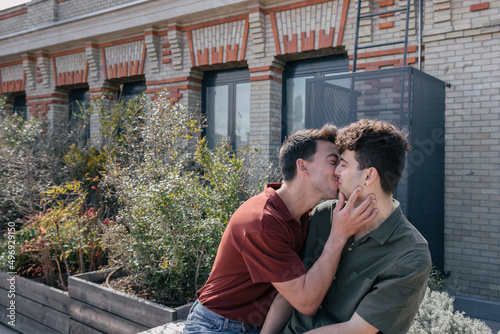 Gay couple kissing outdoors