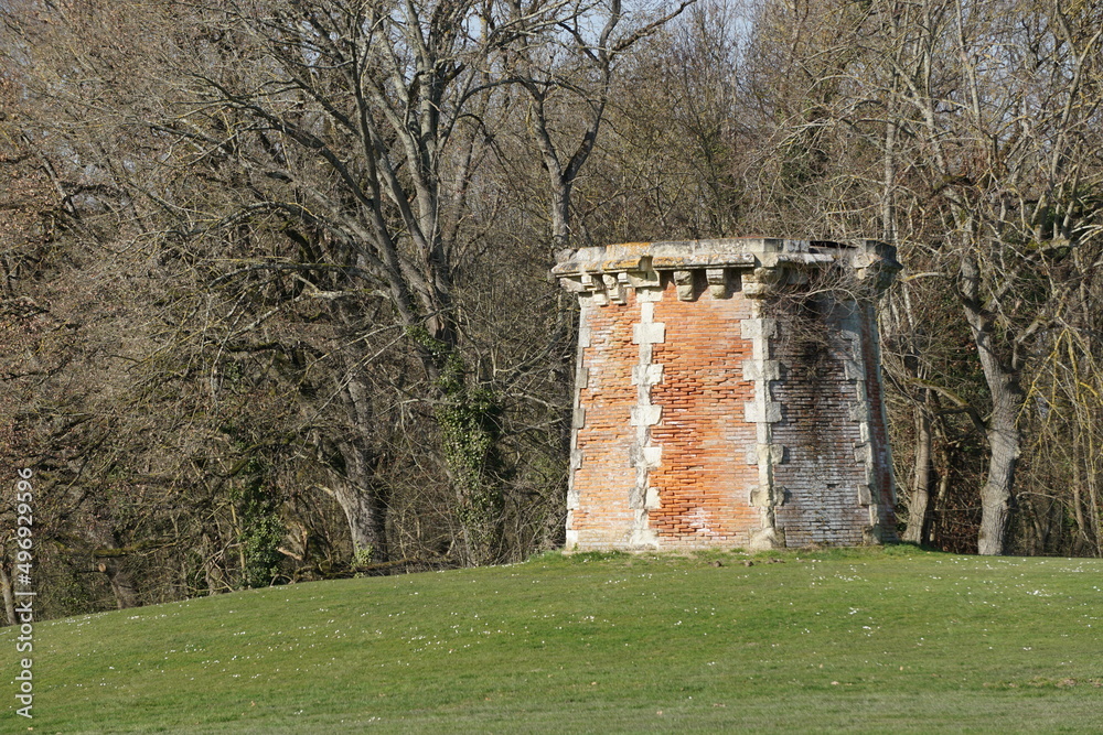 old red brick stone tower in the park, france old red brick stone tower in the park, france