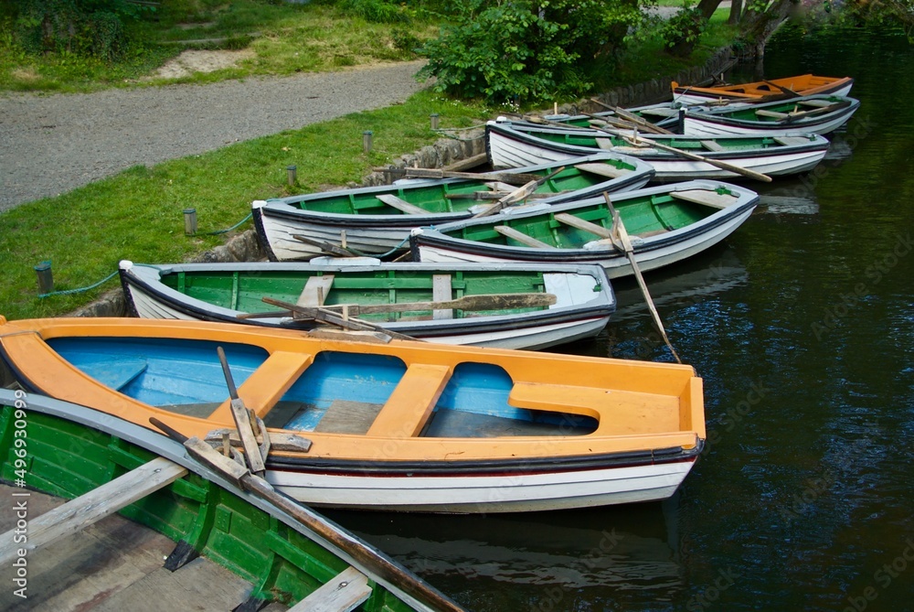 Lots of rowing boats for hire lies at the quay side in an amusement park in Bornholm.
