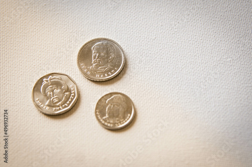 Three Antique Ukrainian Hryvnian Silver Coins with the Faces of Famous Writers on White Backgrounds photo
