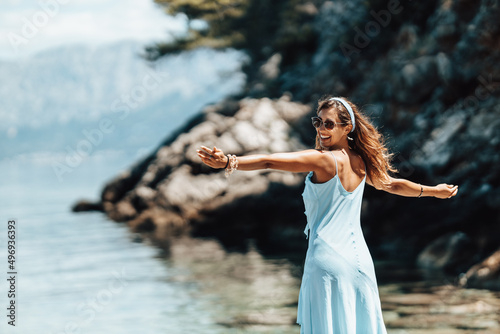 Woman Enjoying A Summer Day At The Beach