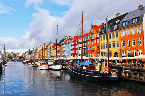 Copenhagen, Denmark - April 1, 2022: Nyhavn district in Copenhagen. City center panoramic view of colorful houses. 