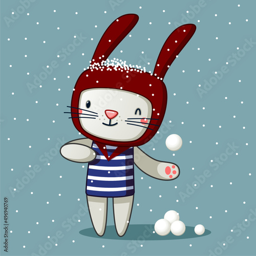 cute rabbit rides and plays snowballs in winter