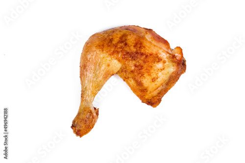 Fresh roasted chicken leg quarters on white isolated background.