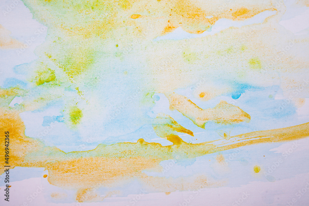 watercolor spots of yellow and blue on a white background. texture. bright spots and splashes of paint on the paper. 