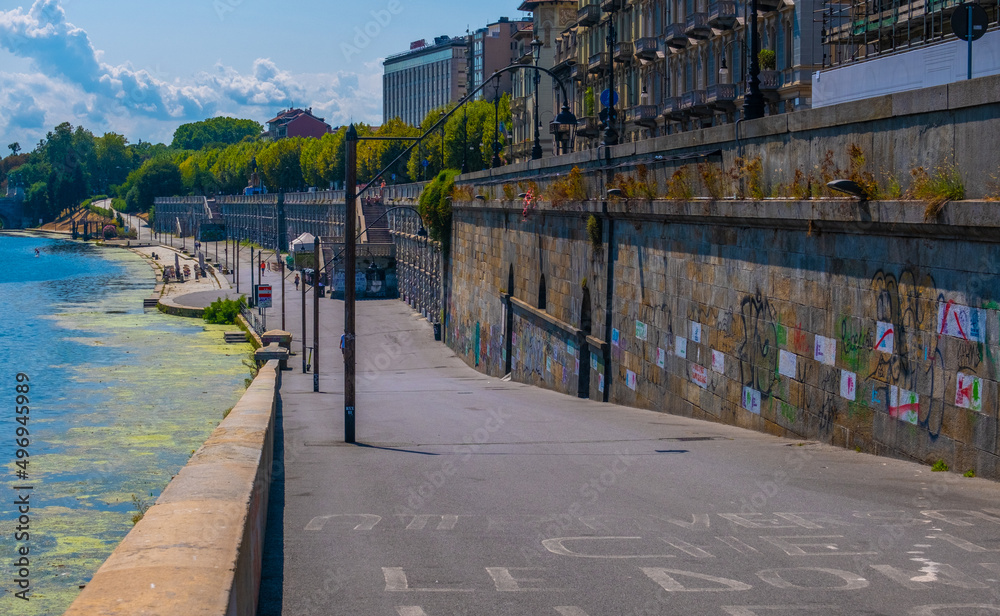 Obraz premium TURIN, ITALY - August 23, 2021: Part of the wall of Murazzi along the Po river