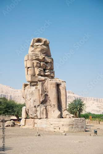 The Colossi of Memnon. Giant stone statues representing Pharaoh Amenhotep III during the 18th Dynasty of Egypt  in front of the Egyptian city of Luxor.